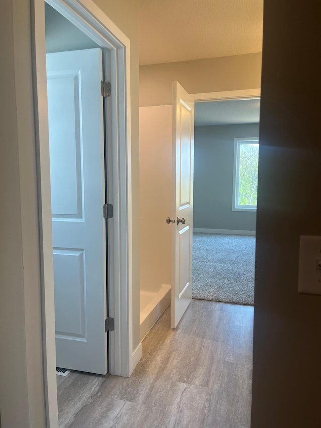 1591 76th St W, Inver Grove Heights, MN 55077 - bathroom featuring wood finished floors and baseboards