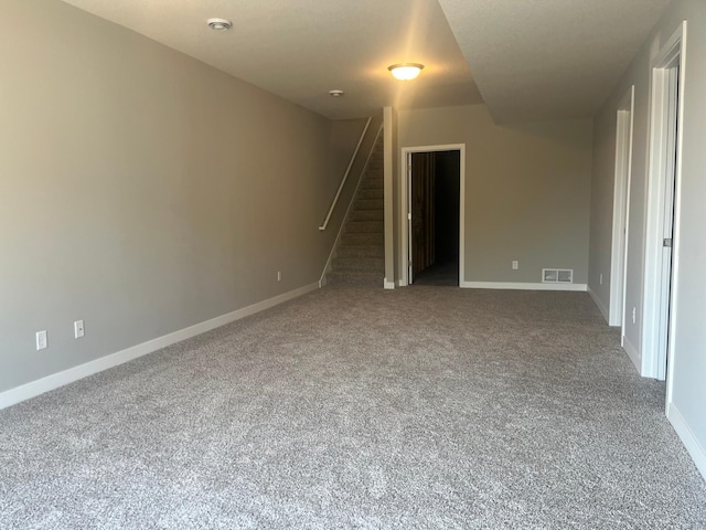 1591 76th St W, Inver Grove Heights, MN 55077 - carpeted empty room with stairway, baseboards, and a smoke detector