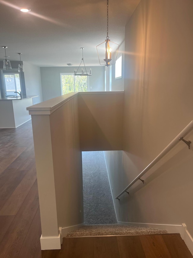 1591 76th St W, Inver Grove Heights, MN 55077 - staircase with wood finished floors, healthy amount of natural light, baseboards, and a chandelier