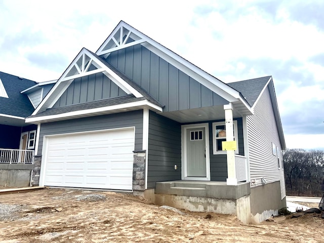 1591 76th St W, Inver Grove Heights, MN 55077 - craftsman-style house with a garage, board and batten siding, a shingled roof, and driveway