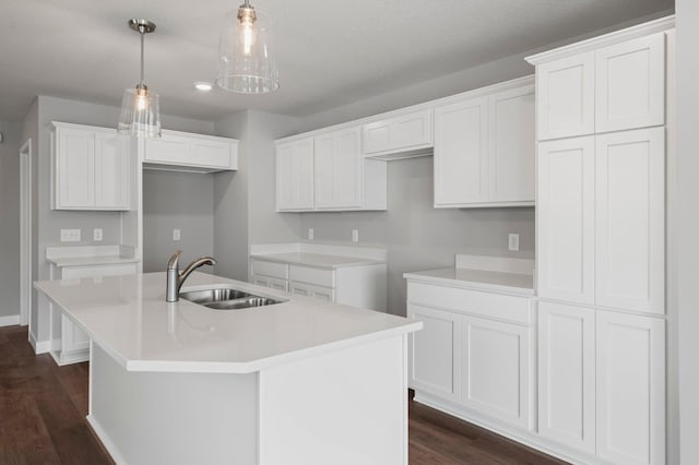 1591 76th St W, Inver Grove Heights, MN 55077 - kitchen featuring a sink, a center island with sink, dark wood-type flooring, and white cabinets