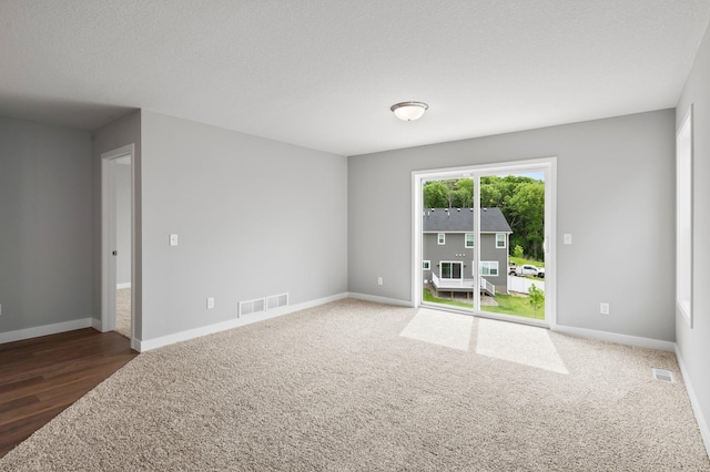1591 76th St W, Inver Grove Heights, MN 55077 - unfurnished room with baseboards, carpet, and wood finished floors