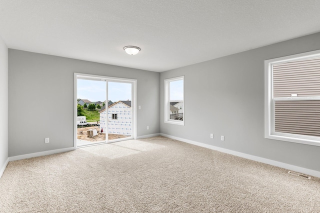 1591 76th St W, Inver Grove Heights, MN 55077 - carpeted spare room featuring baseboards