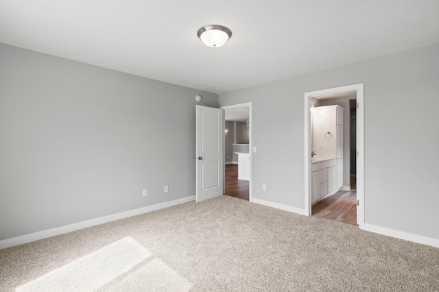 1591 76th St W, Inver Grove Heights, MN 55077 - unfurnished bedroom featuring carpet flooring, baseboards, and ensuite bathroom