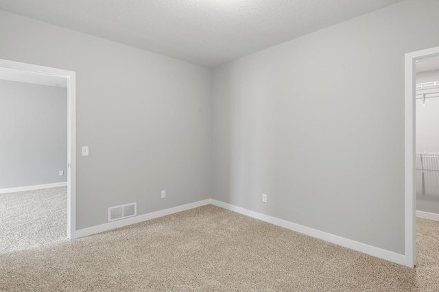 1591 76th St W, Inver Grove Heights, MN 55077 - unfurnished room featuring light carpet and baseboards