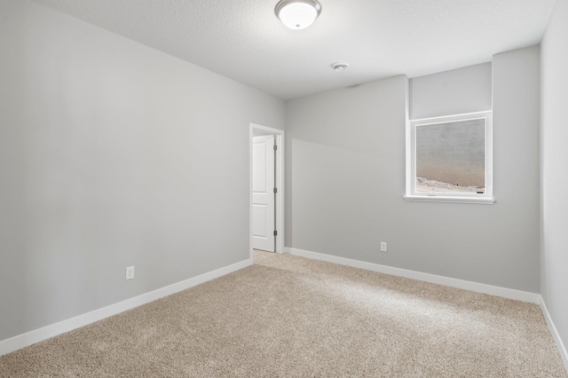 1591 76th St W, Inver Grove Heights, MN 55077 - unfurnished room with light colored carpet, baseboards, and a smoke detector