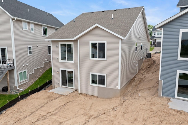 1591 76th St W, Inver Grove Heights, MN 55077 - back of property with roof with shingles, a patio, and cooling unit