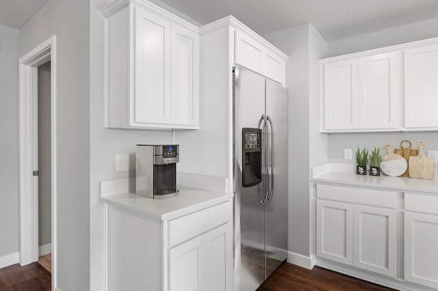 1591 76th St W, Inver Grove Heights, MN 55077 - kitchen with stainless steel fridge with ice dispenser, dark wood-type flooring, light countertops, white cabinetry, and baseboards