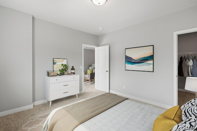 1591 76th St W, Inver Grove Heights, MN 55077 - bedroom with light colored carpet, a walk in closet, baseboards, and a closet