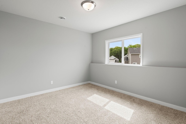 1591 76th St W, Inver Grove Heights, MN 55077 - carpeted spare room with baseboards and a smoke detector