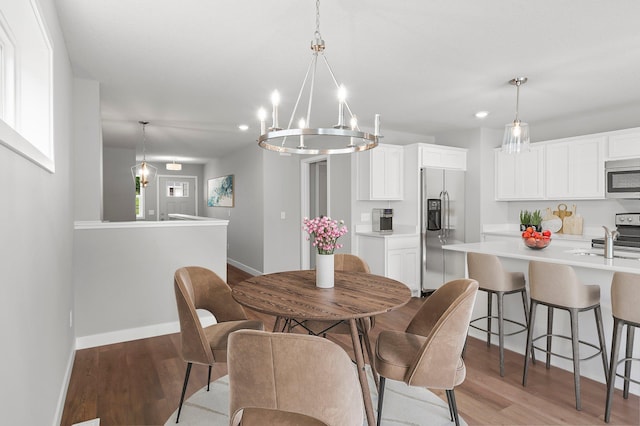 1591 76th St W, Inver Grove Heights, MN 55077 - dining area featuring baseboards, light wood finished floors, a chandelier, and recessed lighting