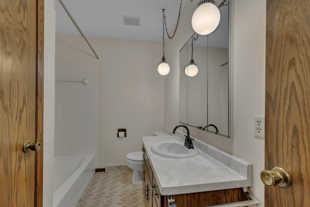 bathroom featuring vanity, toilet, baseboards,  shower combination, and visible vents
