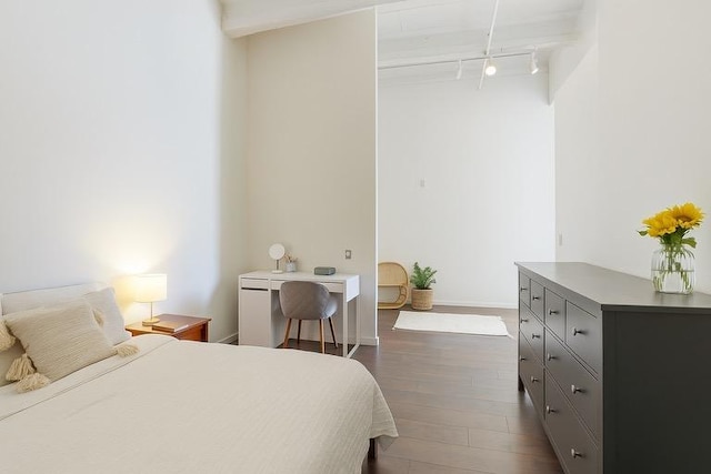 700 Washington Ave N Unit 617, Minneapolis, MN 55401 - bedroom with baseboards, rail lighting, and dark wood-style floors