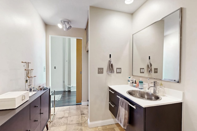 700 Washington Ave N Unit 617, Minneapolis, MN 55401 - bathroom with a sink, baseboards, and two vanities