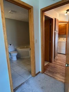 hall featuring washer / clothes dryer