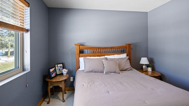 carpeted bedroom with baseboards