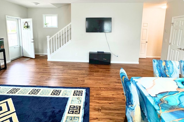 716 Desoto St, Saint Paul, MN 55130 - living room featuring baseboards, stairs, and wood finished floors