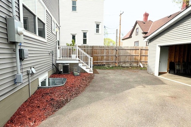 716 Desoto St, Saint Paul, MN 55130 - view of yard with aphalt driveway, a patio area, central air condition unit, and fence