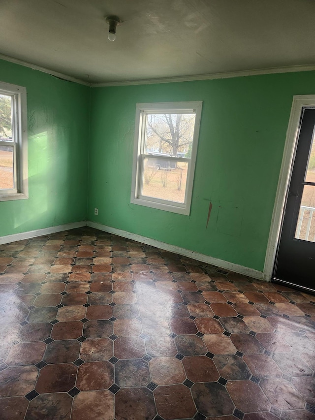 610 Grand Ave, Worthington, MN 56187 - unfurnished room featuring ornamental molding and baseboards