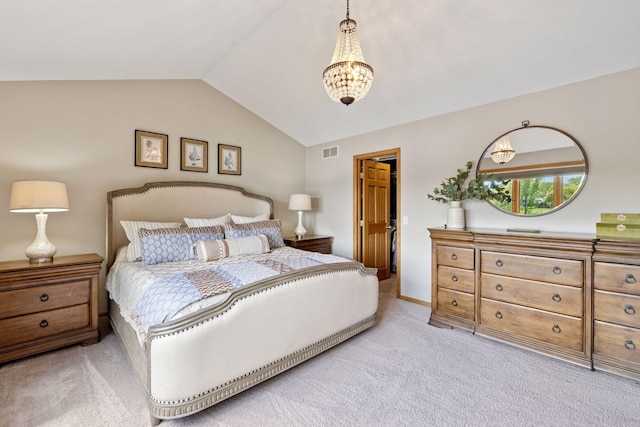 carpeted bedroom with lofted ceiling and a chandelier