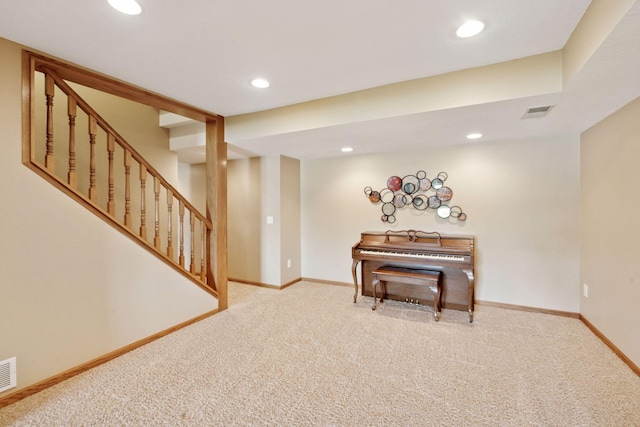 sitting room featuring carpet floors, recessed lighting, baseboards, and stairs