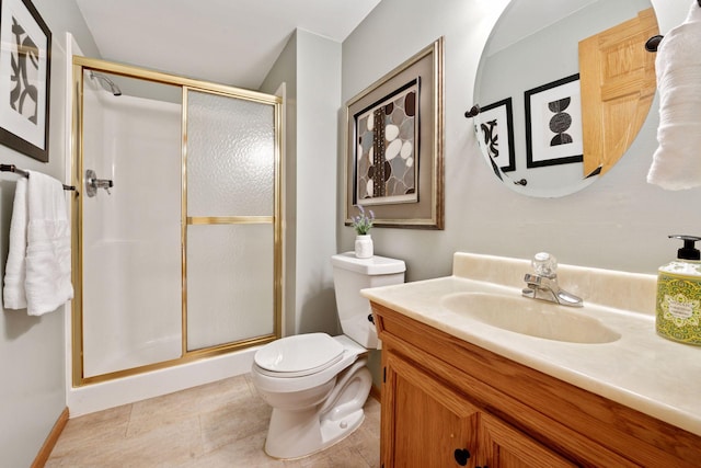full bathroom featuring a stall shower, vanity, toilet, and tile patterned flooring