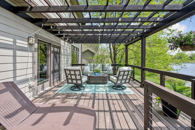 wooden deck featuring an outdoor hangout area and a pergola