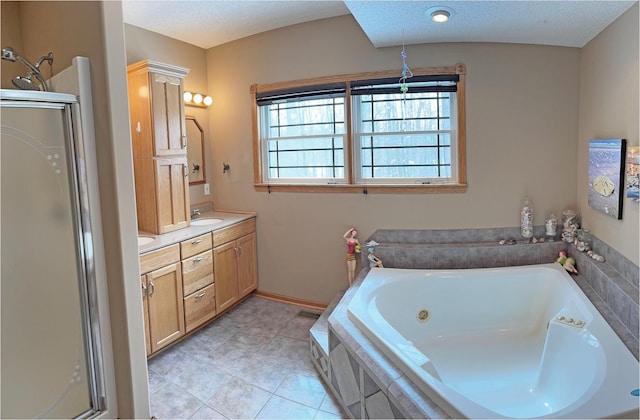 full bath featuring tile patterned flooring, a whirlpool tub, double vanity, a sink, and a stall shower