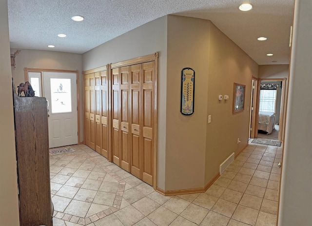 36101 159th Ave, Bagley, MN 56621 - entrance foyer with light tile patterned floors, recessed lighting, baseboards, and a textured ceiling