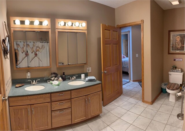 36101 159th Ave, Bagley, MN 56621 - full bath featuring tile patterned flooring, toilet, and double vanity
