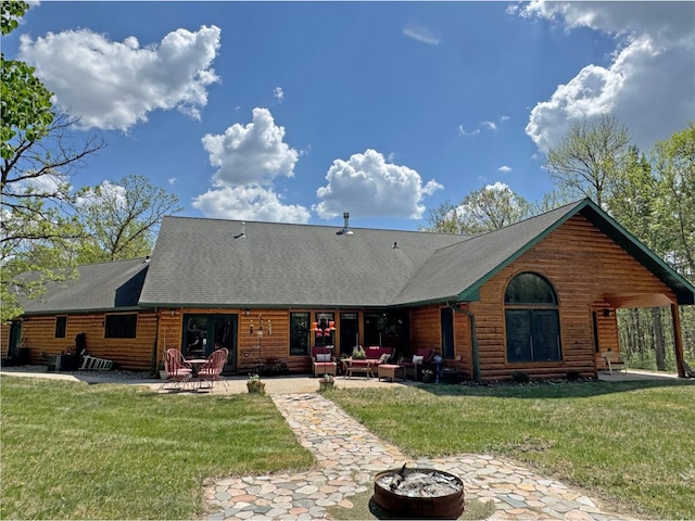 36101 159th Ave, Bagley, MN 56621 - rear view of property featuring a patio, a lawn, and faux log siding