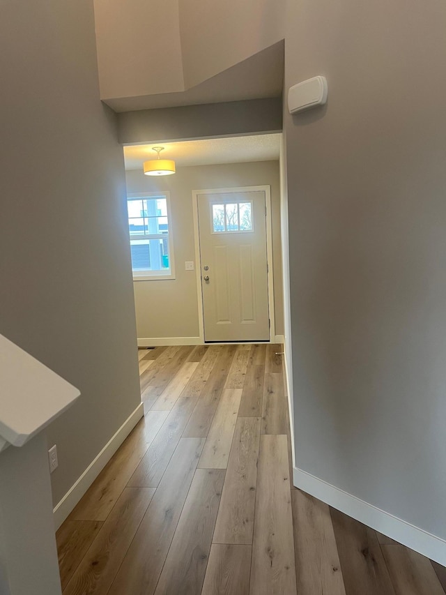 1595 76th St W, Inver Grove Heights, MN 55077 - entryway with baseboards and light wood-type flooring