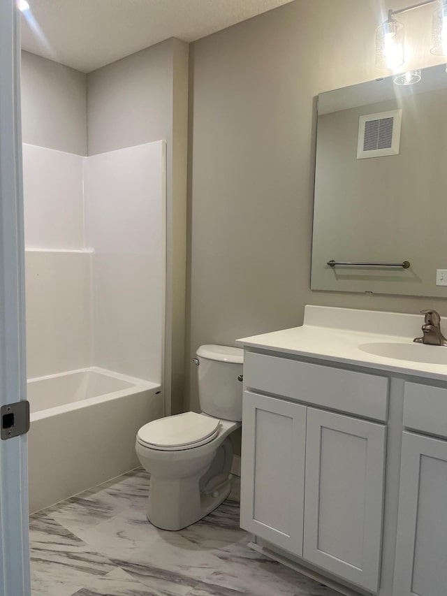 1595 76th St W, Inver Grove Heights, MN 55077 - full bathroom featuring toilet, marble finish floors, vanity, and shower / tub combination