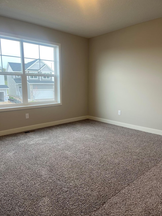 1595 76th St W, Inver Grove Heights, MN 55077 - spare room with carpet floors and baseboards