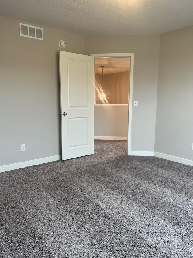 1595 76th St W, Inver Grove Heights, MN 55077 - carpeted empty room featuring a chandelier, baseboards, and a smoke detector