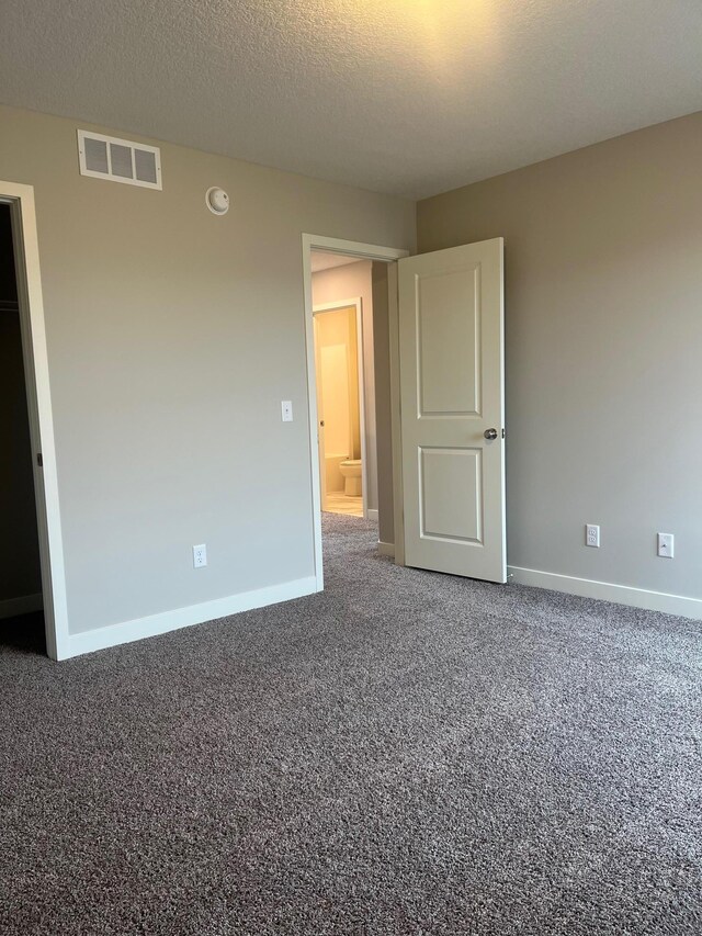 1595 76th St W, Inver Grove Heights, MN 55077 - unfurnished bedroom featuring baseboards and carpet