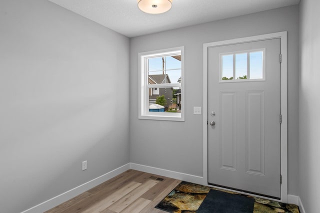 1595 76th St W, Inver Grove Heights, MN 55077 - entrance foyer featuring baseboards and light wood-type flooring