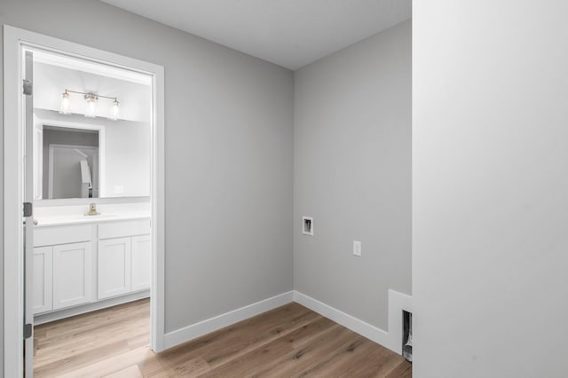 1595 76th St W, Inver Grove Heights, MN 55077 - washroom featuring light wood-type flooring and baseboards