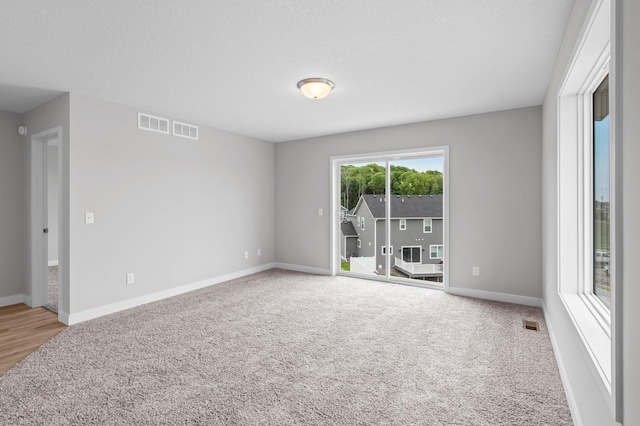 1595 76th St W, Inver Grove Heights, MN 55077 - unfurnished room featuring carpet flooring and baseboards