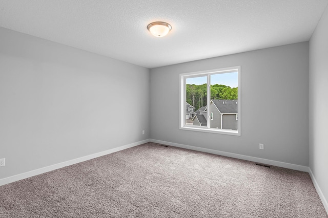 1595 76th St W, Inver Grove Heights, MN 55077 - spare room featuring carpet floors and baseboards