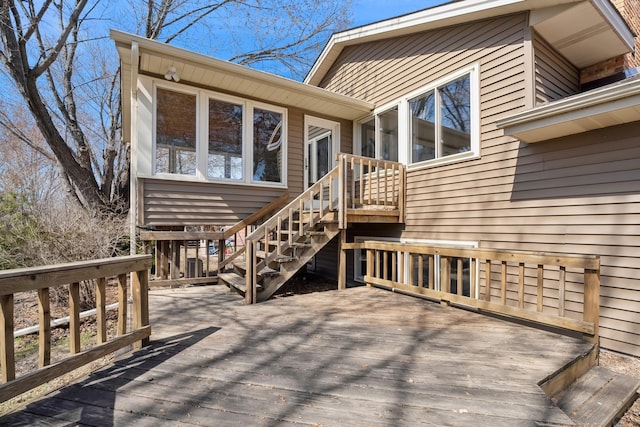 back of property featuring a deck and stairs