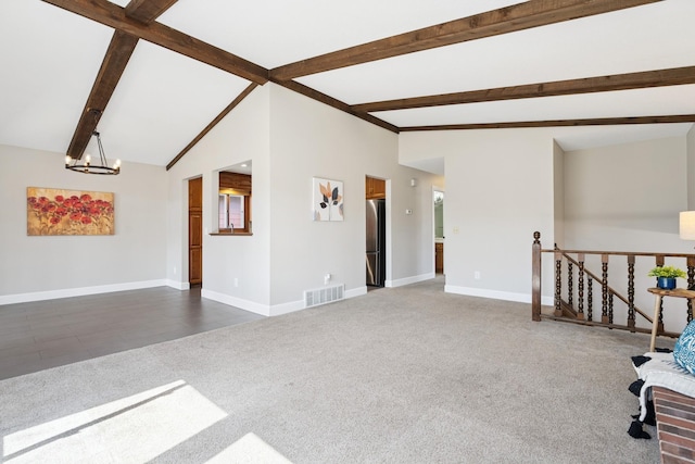 interior space with lofted ceiling with beams, carpet, visible vents, an upstairs landing, and baseboards