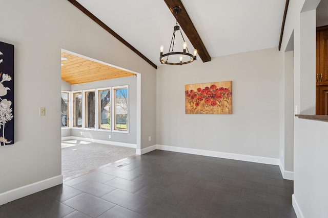 interior space with lofted ceiling with beams, baseboards, and a notable chandelier
