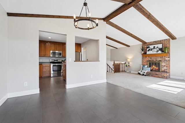 unfurnished living room with a fireplace, a notable chandelier, baseboards, and beamed ceiling