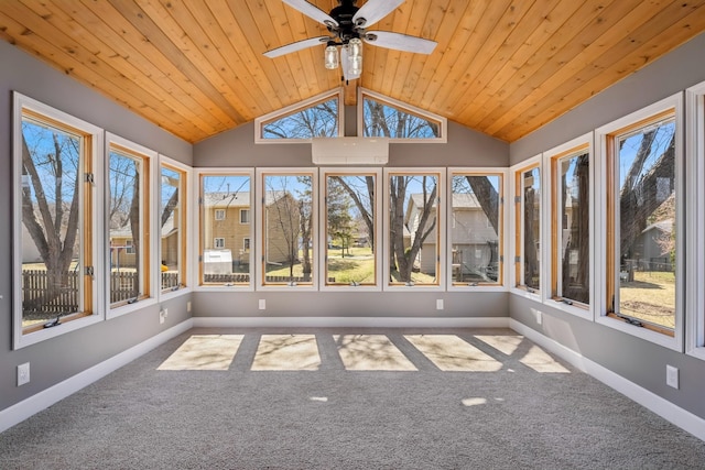 unfurnished sunroom featuring carpet, wood ceiling, baseboards, and lofted ceiling