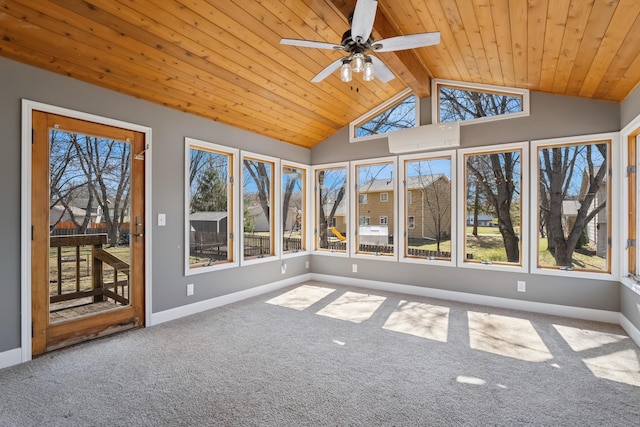 unfurnished sunroom with baseboards, a ceiling fan, wood ceiling, carpet floors, and lofted ceiling