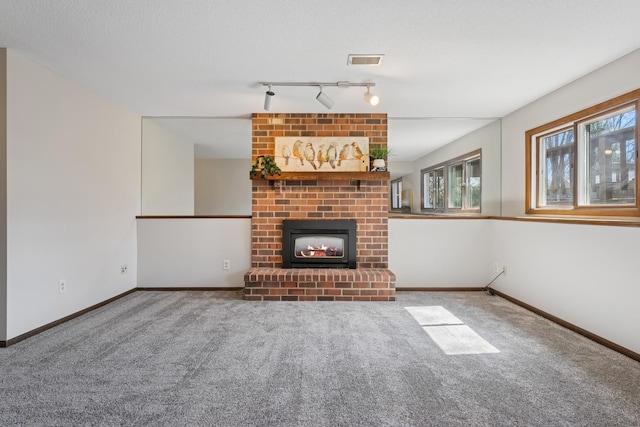 unfurnished living room with baseboards, carpet flooring, and a brick fireplace