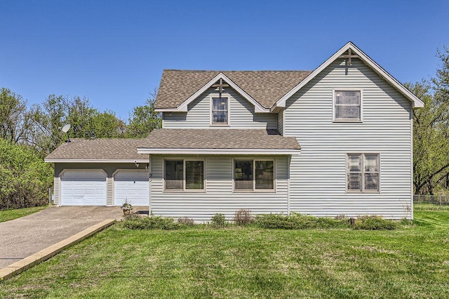 traditional home featuring a shingled roof, driveway, a front lawn, and a garage