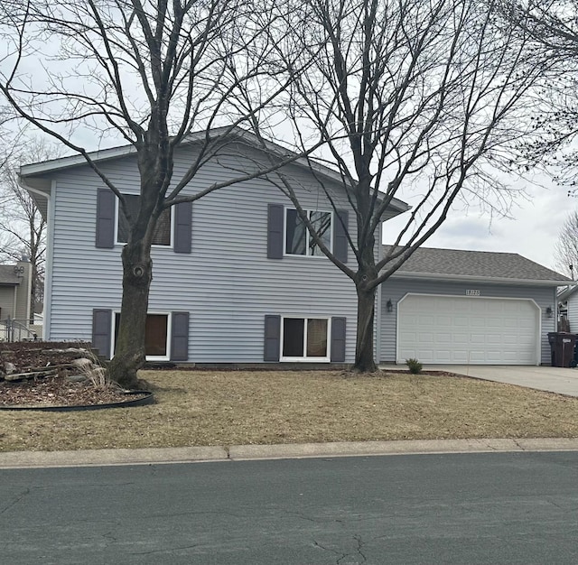 18125 Echo Ter, Farmington, MN 55024 - view of front of house featuring concrete driveway, an attached garage, and a front lawn
