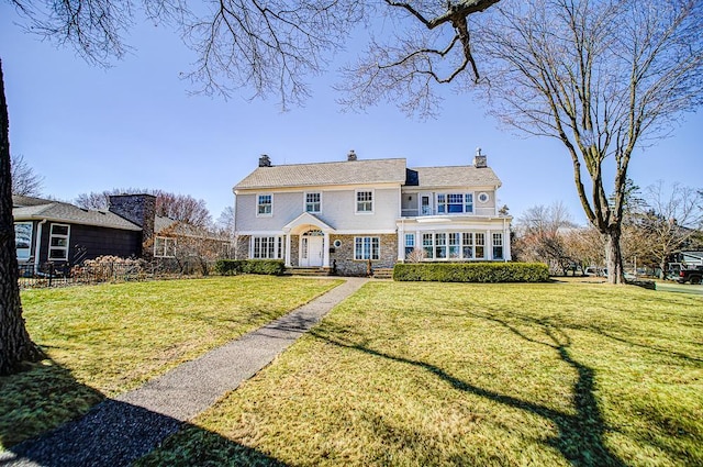 4927 Lake Ave, White Bear Lake, MN 55110 - view of front of property with fence, a chimney, and a front yard